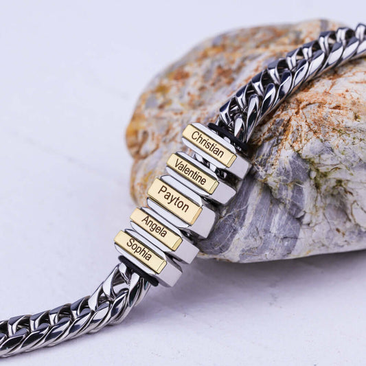 Personalized multi-name bracelet with silver and gold accents on natural stone background.